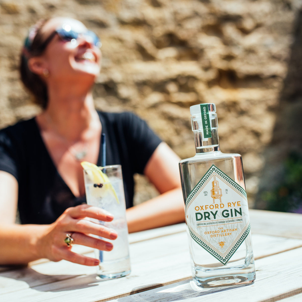 Enjoying a gin and tonic made with Oxford Rye Organic Dry Gin
